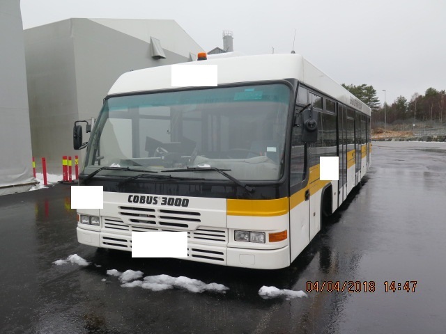 Cobus 3000 Apron Bus standing outside in front of a hall