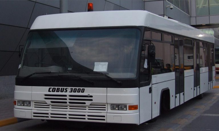Apron Bus Cobus 3000 standing in front of a terminal